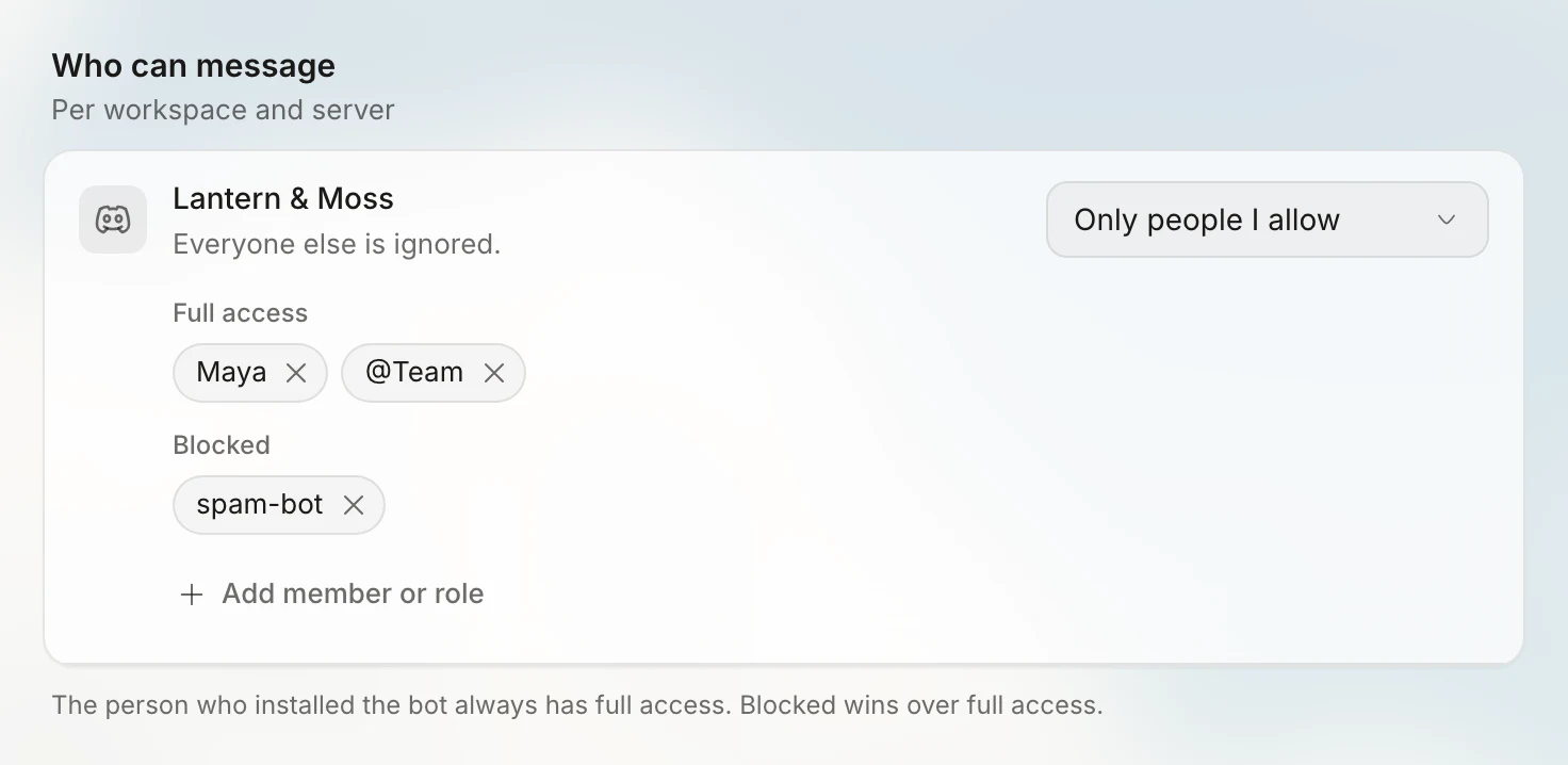 The Who can message card, subtitled 'Per workspace and server'. For the Lantern & Moss server, the mode is set to Only people I allow, with the note 'Everyone else is ignored.' Full access lists Maya and the role @Team, Blocked lists spam-bot, and there is an Add member or role button. The footer reads 'The person who installed the bot always has full access. Blocked wins over full access.'